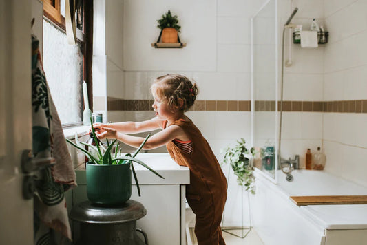 Little girl washing her hands