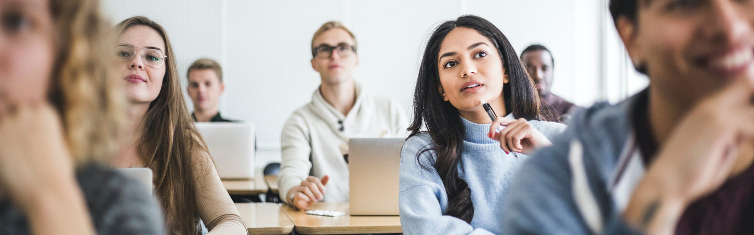 group of university students in class listening